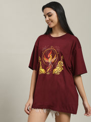 Front view of a woman wearing a plain maroon Fire women's over-sized T-shirt, showcasing its relaxed fit and simple crew neckline